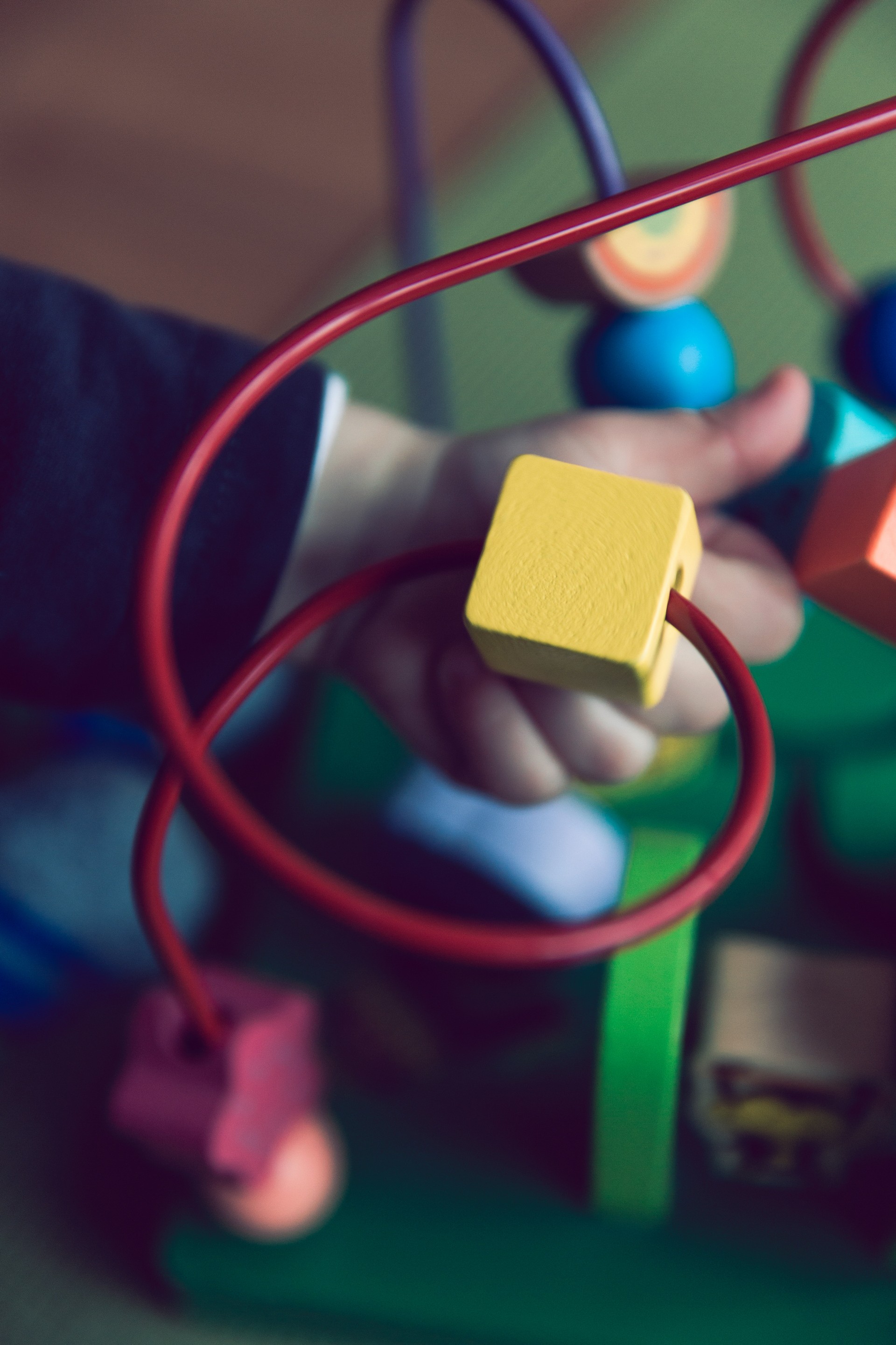 kid plays with activity toy